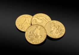 gold round coins on black surface